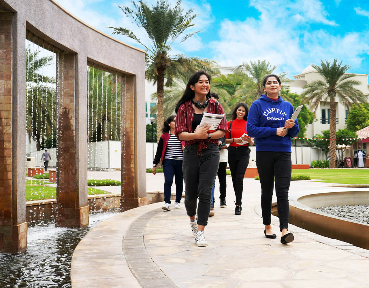 Students walking with their book at Dubai International Academic City